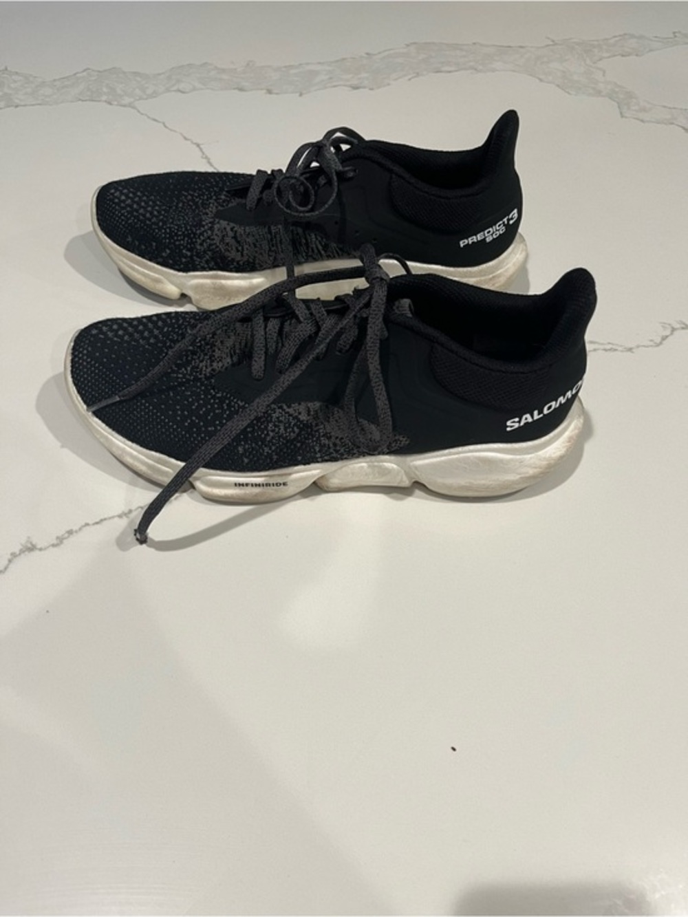 Salomon Black and White Knit Running Shoes womens 8